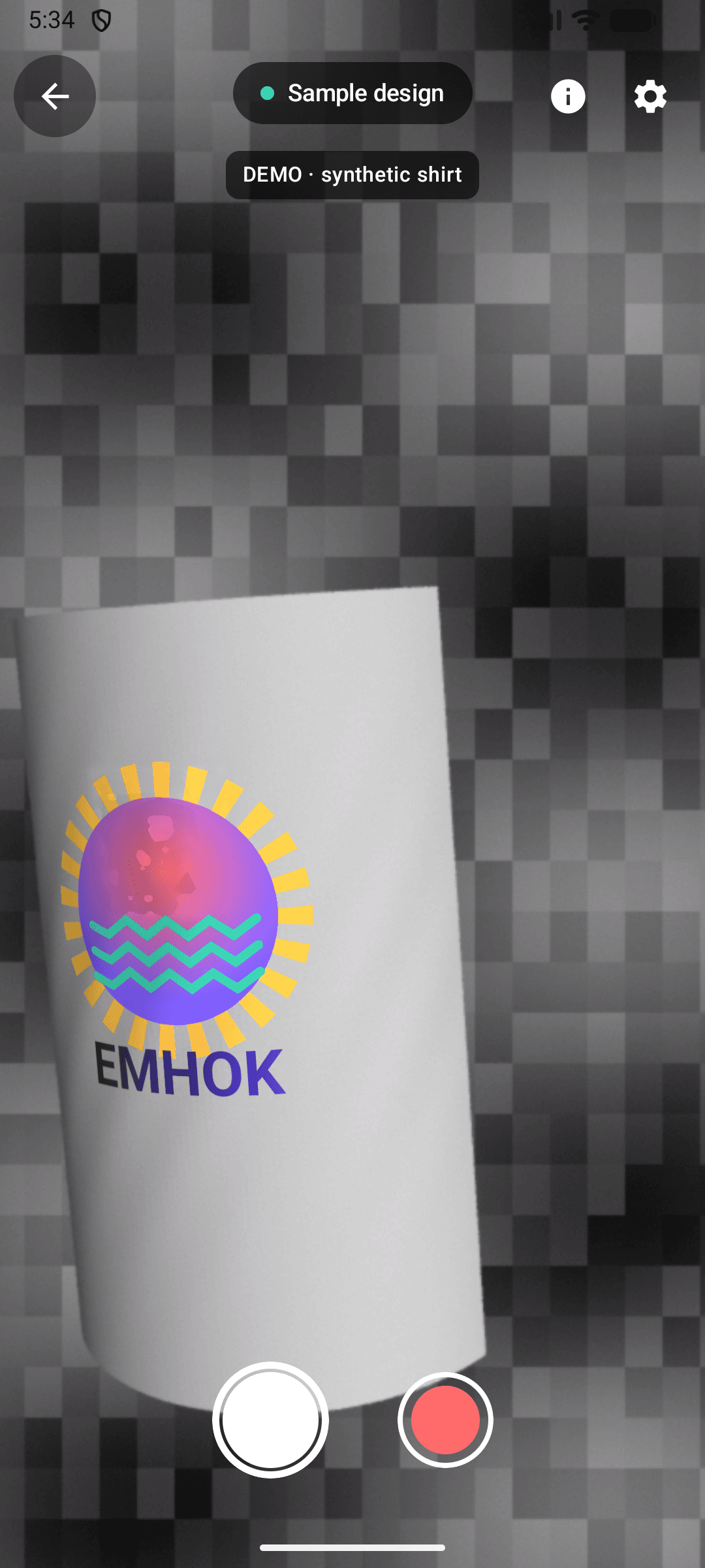 The Emhok scanner showing the sample design, a sun over waves, drawn on a virtual shirt.